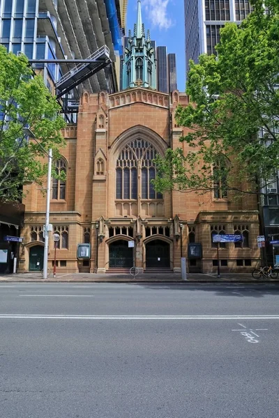 Heritage-listed, Interwar Gothic style, AD 1935-37 built Saint Stephen\'s Uniting Church sandstone facade facing Macquarie Str.in the CBD backed by modern, high-rise skyscrapers. Sydney-NSW-Australia.