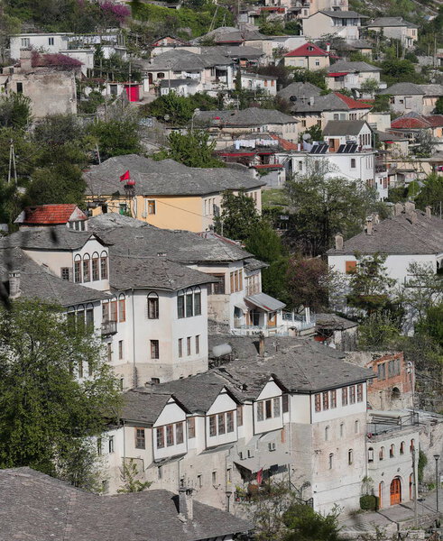 Hillside Ottoman houses dating from the XVII-XVIII centuries built with stone blocks and featuring roof covers of flat dressed stones, northwestwards view from the city fortress. Gjirokaster-Albania.