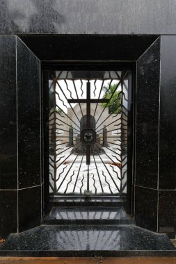 Entrance door to a pantheon, iron grate featuring the motto 'rogad por nosotros gracias-como amareis sereis amados:pray for us thank you-as you will love you will be loved'. Colon Cemetery-Havana-Cuba clipart