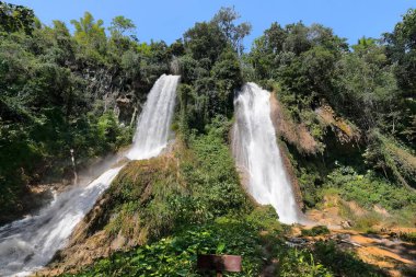 Salto El Rocio Waterfall two branches, Centinelas del Rio Melodioso Hike, Guanayara Park, Sierra de Escambray Mountains. Cienfuegos Province-Cuba-216 clipart