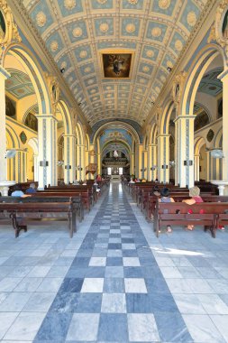 Santiago, Cuba-October 20, 2019: Inside the Neoclassical Nuestra Senora Asuncion Cathedral rebuilt in 1818 over other previous temples dating from 1522, all destroyed by earthquakes and pirate attacks clipart