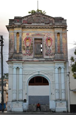 Havana, Cuba-October 24, 2019: The Teatro Cespedes Theater at Calles Cespedes and Marti Streets corner was built in 1921 and in 1988, due to lack of maintenance, was closed never to be repaired again. clipart