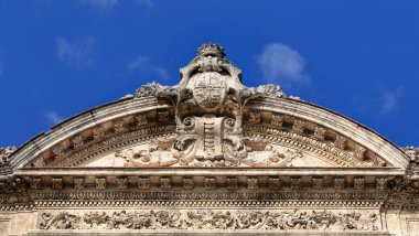 Havana, Cuba-October 26, 2019: Pediment with Spanish heraldry on the Palacio Matrimonios-Wedding Palace, neo-Renaissance building from 1914 at 302 Paseo del Prado Promenade west side, Habana Centro. clipart