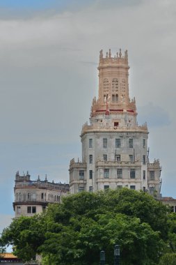 Havana, Cuba-October 26, 2019: AD 1927, Art-Deco Telefonica or Aguila y Dragones Building, 62 m high, Morales and Co.architects, Calles Aguila and Dragones Streets junction with Avenida Zanja Avenue. clipart