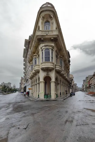 stock image Havana, Cuba-October 26, 2019: Early 1900s three-story, former Cafe Tiburon Eclectic building at 12 Paseo del Prado Promenade corner with Calle San Lazaro Street, now a tenement house and a cafeteria.