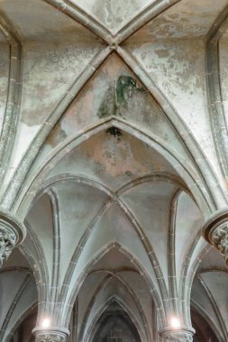 Mont-Saint-Michel, France-October 19, 2020: The large Knights Hall rib vault, perhaps the abbey scriptorium built in 1220-1225 in Gothic style on the second level of La Merveille-The Marvel west part. clipart