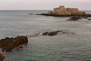 Saint-Malo, France-October 20, 2020: Northeastward view at high tide from Queen.s Bastion to Fort National built in 1689 on the Rocher de l'Illette Rock by engineer Simon Garangeau on plan by Vauban. clipart