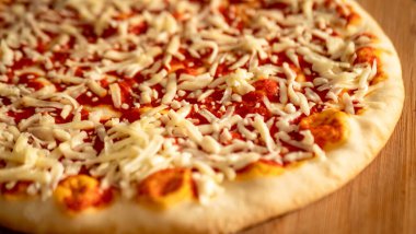 Pepperoni Pizza with Mozzarella cheese, salami, Tomatoes, pepper, Spices and Fresh Basil, Italian pizza