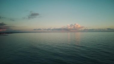 Aerial view of a drone flying over the sea, aerial shot of a gliding ocean surface