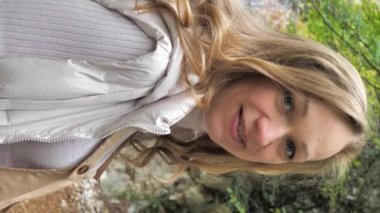 VERTICAL VIDEO POV, smiling charming natural beauty young woman, perfect skin, posing. Cute pretty healthy fresh female relaxing having fun with positive emotions close up portrait.