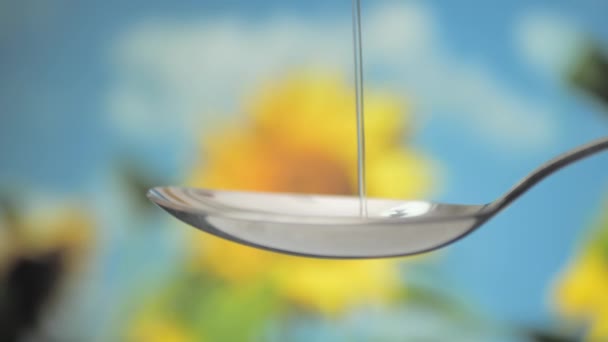 Pour Olive Oil Spoon Sunflower Background — Video Stock