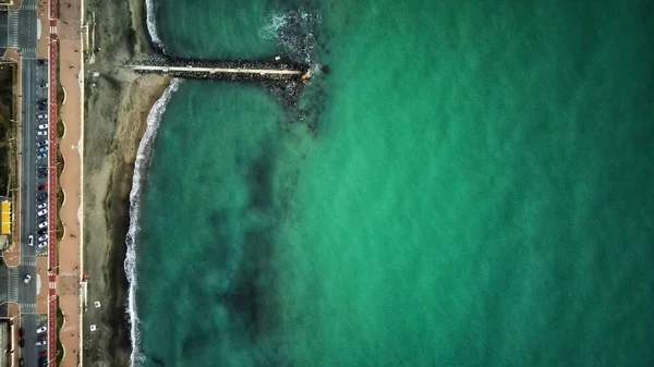 stones and sea of turquoise color. drone shot