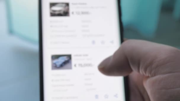 Man Chooses Buy Car Site Looking Used Vehicle Buy Smartphone — Vídeo de Stock