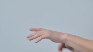Skin care procedures. Close up shot of unrecognizable woman applying moisturizer to skin of hands while enjoying spa at home, slow motion.