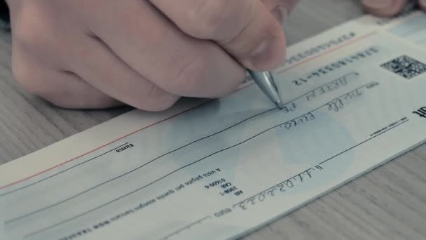 Close Image Persons Hand Filling Out Bank Check 1000 Euros — стоковое видео