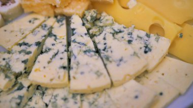 Sliced pieces of Roquefort cheese. Close-up.