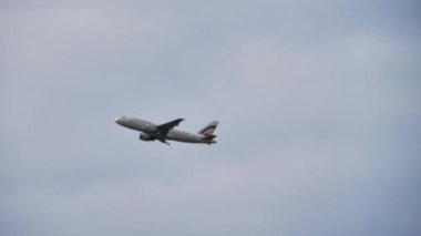 The plane takes off from the airport on the background of the sky, Transportation of passengers on vacation or travel