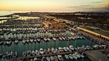 Top down view of boats parked near the beach at sea.