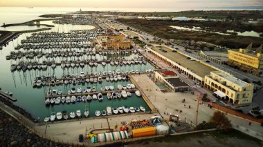 Top down view of boats parked near the beach at sea.