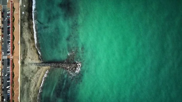 stones and sea of turquoise color. drone shot