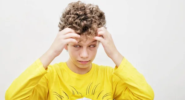 Young Surprised Guy Curly Hair Holds His Hair His Hands — Stock Photo, Image