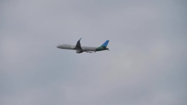 The plane takes off from the airport on the background of the sky, Transportation of passengers on vacation or travel