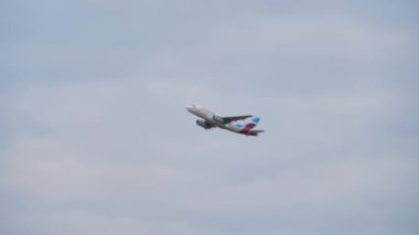 The plane takes off from the airport on the background of the sky, Transportation of passengers on vacation or travel