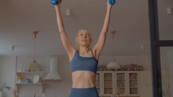 Determined Attractive Sporty Fit Senior Woman Doing Dumbbell Standing Shoulder — Stock Video