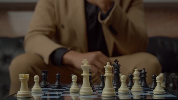 Close Black Male Businessman Hand Moving Black Chess Queen Piece — Stock Video