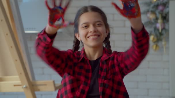 Portrait Positive Mischievous Latin Teenage Girl Painted Hands Having Fun — Video Stock