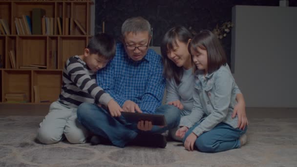 Positive Asian Multigenerational Family Cute Elementary Age Sibling Sitting Floor — Stock Video