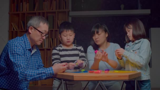 Happy United Asian Multigenerational Family Cute Elementary Age Sibling Making — Stock video