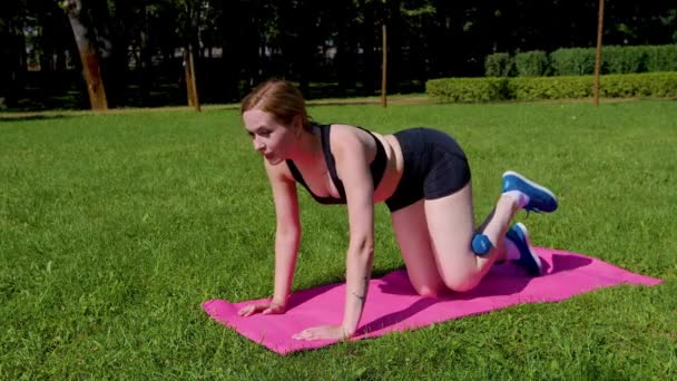Motivated Determined Charming Athletic Fit Woman Practicing Donkey Kick Dumbbell — Stock Video