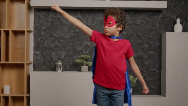 Portrait Determined Cute School Age Boy Wearing Superhero Cape Mask — Stock Video