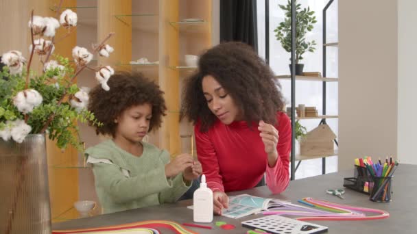Creative Engrossed Action Cute Preadolescent African American Daughter Help Pretty — Stock Video