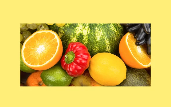 Various vegetables and fruits in yellow frame. Beautiful background. Wide photo.