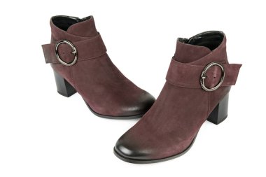 Beautiful female ankle boots isolated on white background.