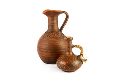 Ceramic amphora and small pitcher isolated on white background.