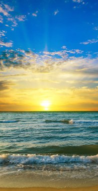 Beautiful tropical sea and sunrise. Vertical photo.