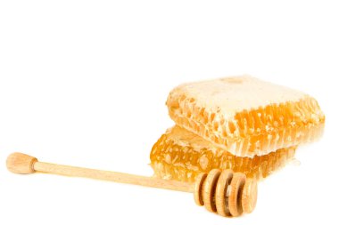 Honey in honeycomb and dipper isolated on white background. Free space for text.