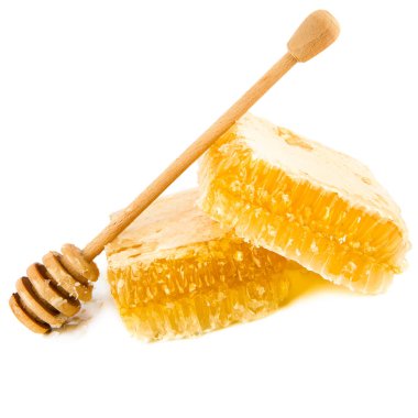Honey in honeycomb and dipper isolated on white background. Free space for text.