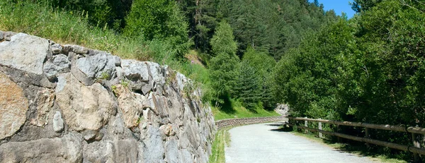 Pedestrian road in the mountains of Andorra. Wide photo.
