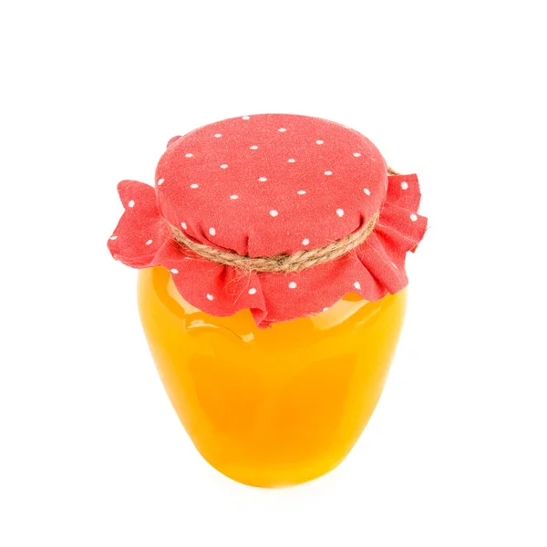 在一个白色背景上隔离的罐子里的天然蜜蜂蜂蜜 — 图库照片