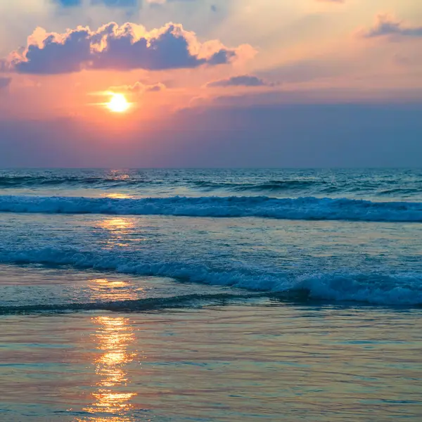 Tropical sea and Bright sunrise. Vertical photo