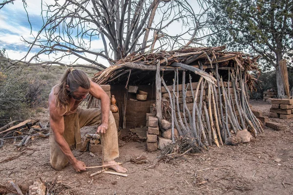Male Survivalist Makes Friction Fire Front Simple Shelter Mountains — Stock Photo, Image