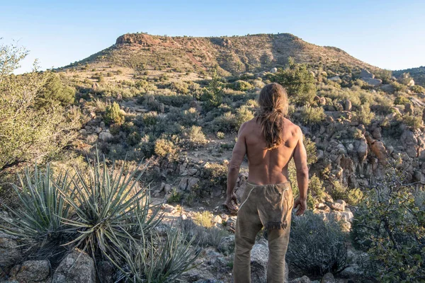 Wild Shirtless Man Rugged Desert Environment Looking Away Camera Mountain — Stock Photo, Image