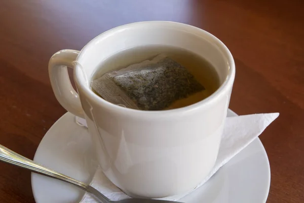 Classic Restaurant Presentation Tea Bag White Tea Cup Water Napkin Stock Photo