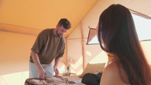Low Angle Just Married Young Biracial Woman Man Unpacking Clothes — Vídeo de Stock
