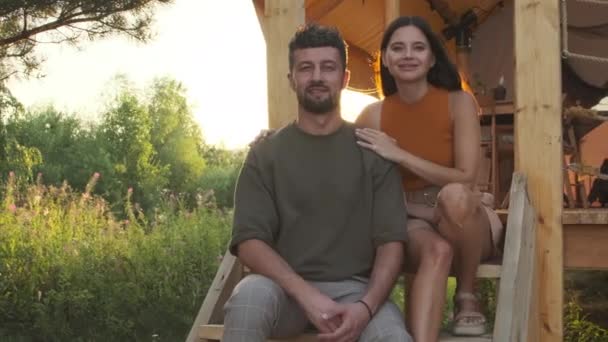 Portrait Young Biracial Wife Husband Sitting Stairs Glamping Posing Looking — Stockvideo