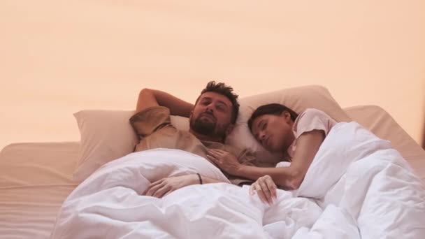 Young Dark Haired Biracial Woman Bearded Husband Waking Bed Hotel — Videoclip de stoc